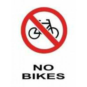 A sign featuring a red circle with a diagonal line over a black bicycle icon, accompanied by the text 